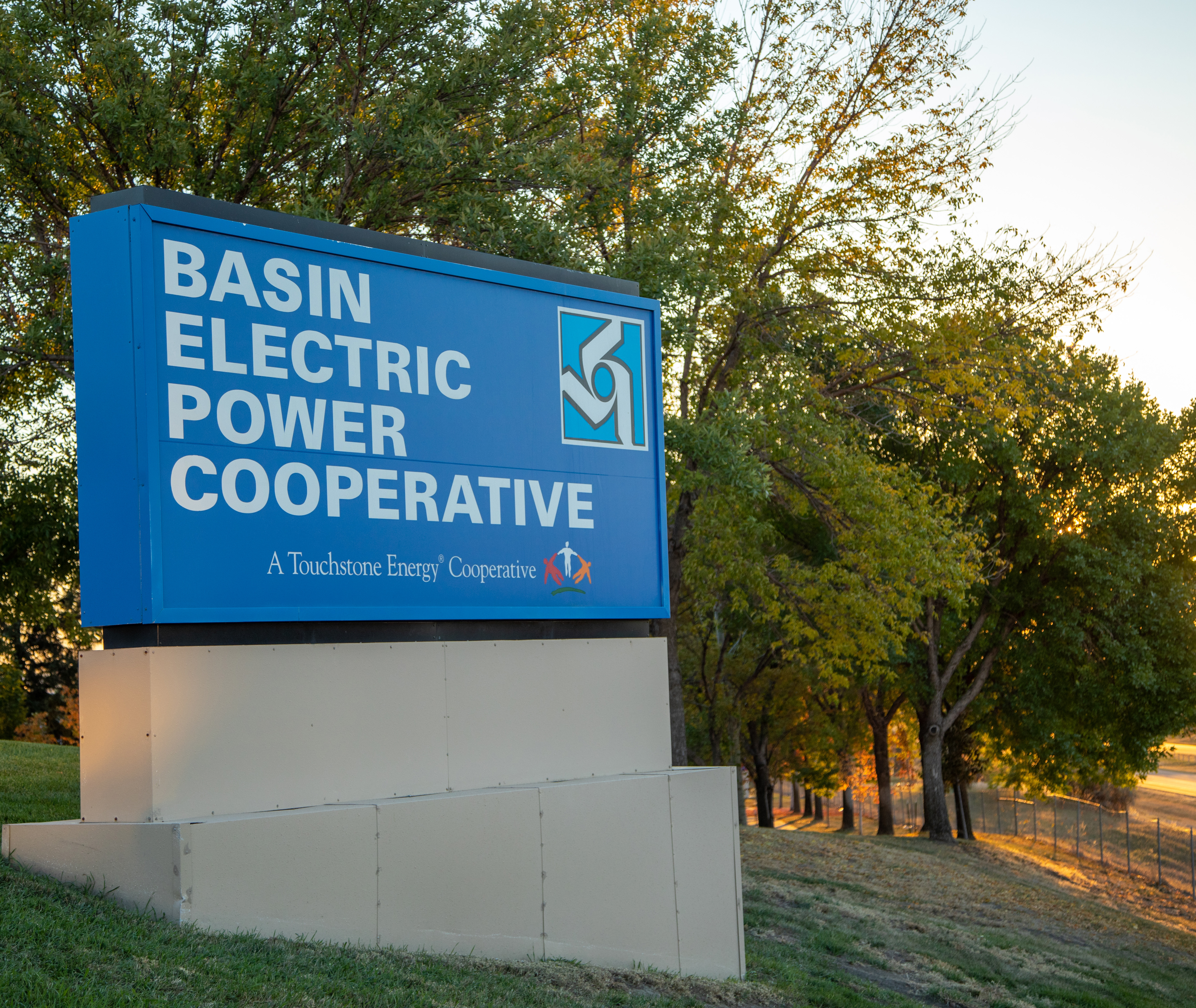 Fall trees by the Basin Electric sign